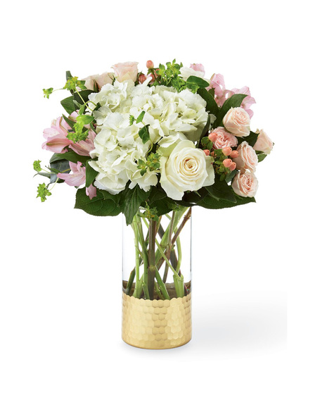 Hydrangea and rose bouquet in a designer glass vase