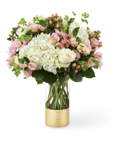Hydrangea and rose bouquet in a designer glass vase