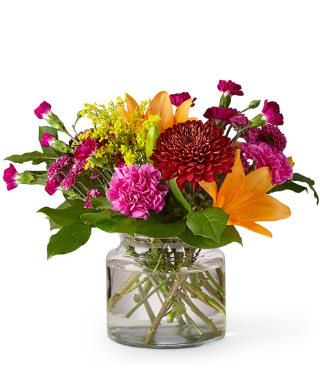 Vibrant Mixed Fall Flowers in a Glass Vase