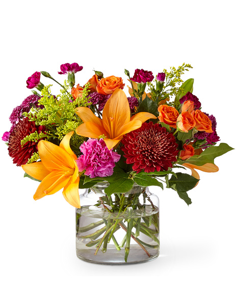 Vibrant Mixed Fall Flowers in a Glass Vase