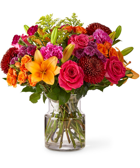 Vibrant Mixed Fall Flowers in a Glass Vase