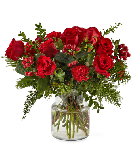 Red holiday flowers in designer vase