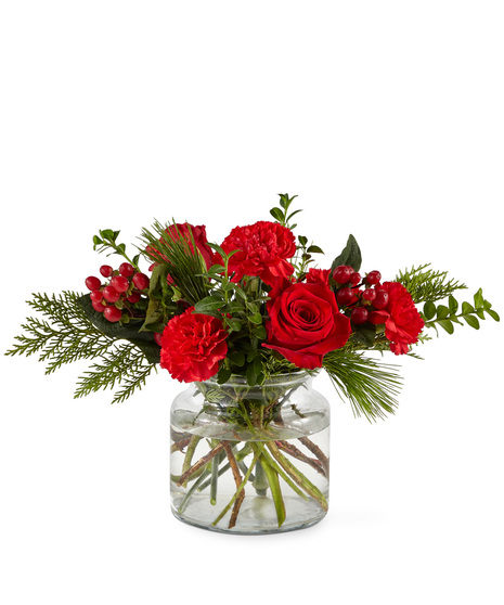 Red holiday flowers in designer vase