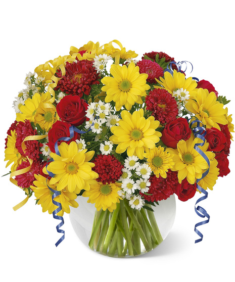 Bright, festive flowers with curly ribbon