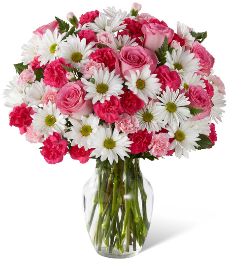 Pink and white flowers in a glass vase