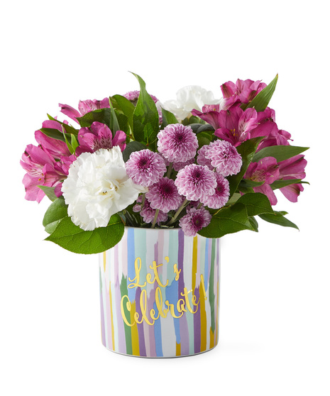 Birthday flowers in a vase that says Lets Celebrate