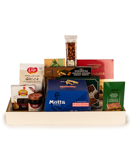 Italian Christmas gift basket with gourmet treats displayed in a marble style tray