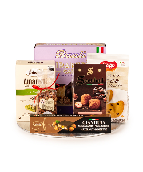 Silver holiday gift tray with tiramisu cake, amaretti, truffles, cookies, torrone, and nuts wrapped in cello