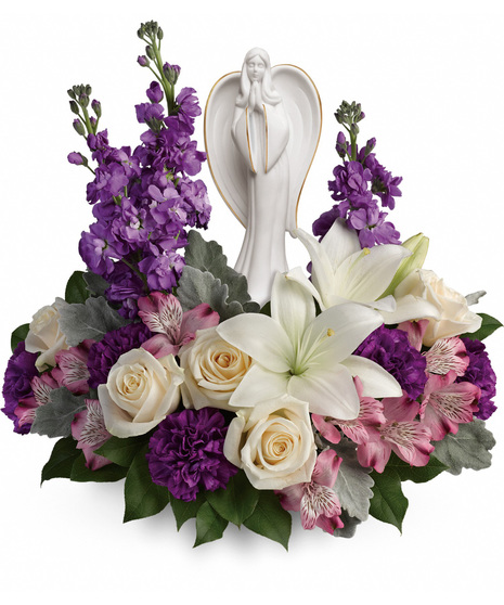 Lovely sympathy flowers with graceful scupture
