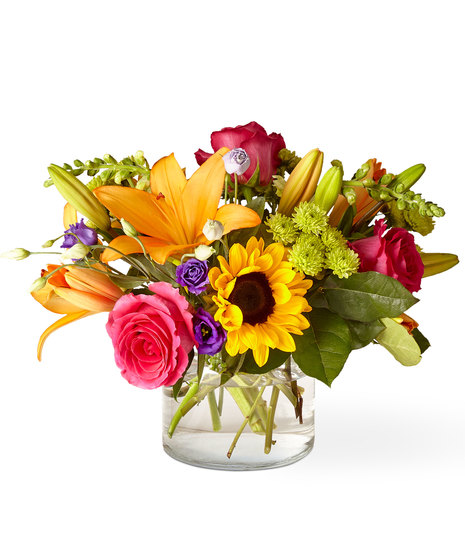 Glass Vase of Flowers including Sunflowers