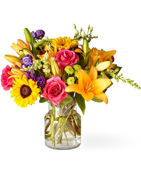 Glass Vase of Flowers including Sunflowers
