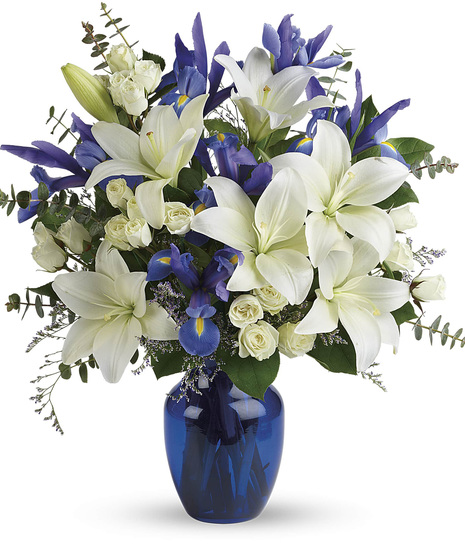White and Blue Flowers in a Blue Vase