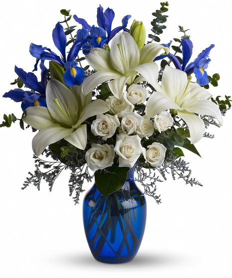 White and Blue Flowers in a Blue Vase