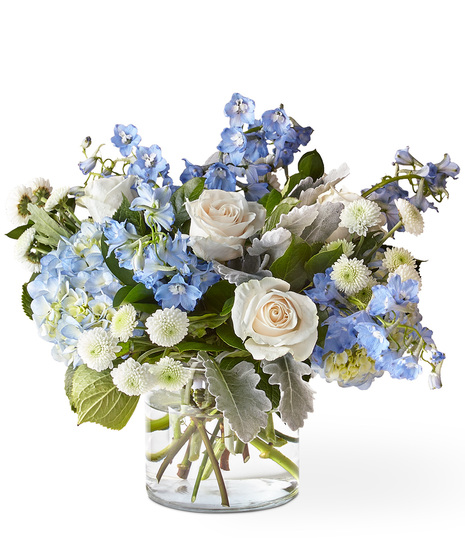 White and blue flowers in a glass vase