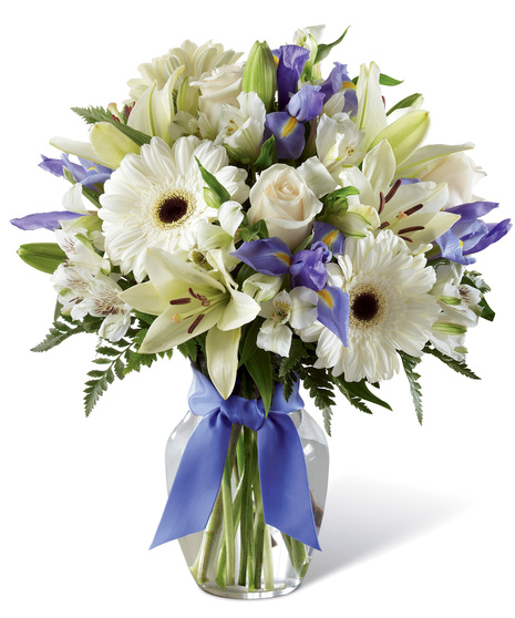 White and Purple Flowers in a Glass Vase With Bow