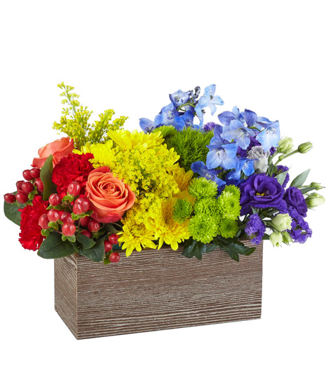 Brightly Coloured Flowers in a Rustic Wooden Crate