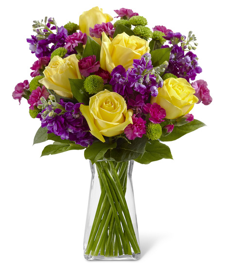 Yellow Roses With Pink and Purple Flowers in a glass vase