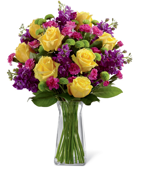 Yellow Roses With Pink and Purple Flowers in a glass vase