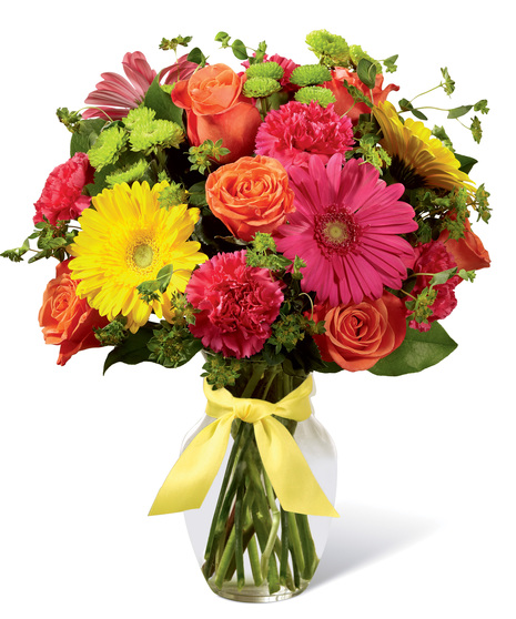 Vibrant flowers in a clear glass vase