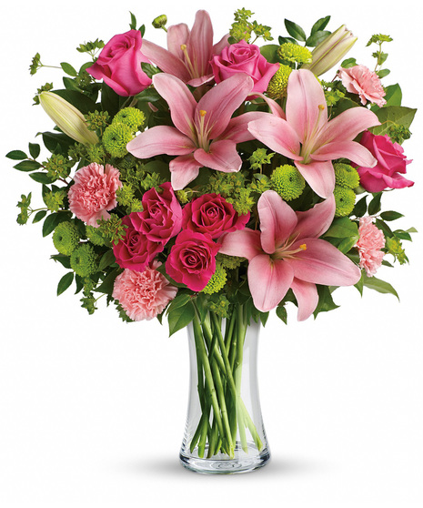 Pink, hot pink and green flowers including roses and lilies