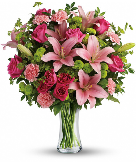 Pink, hot pink and green flowers including roses and lilies