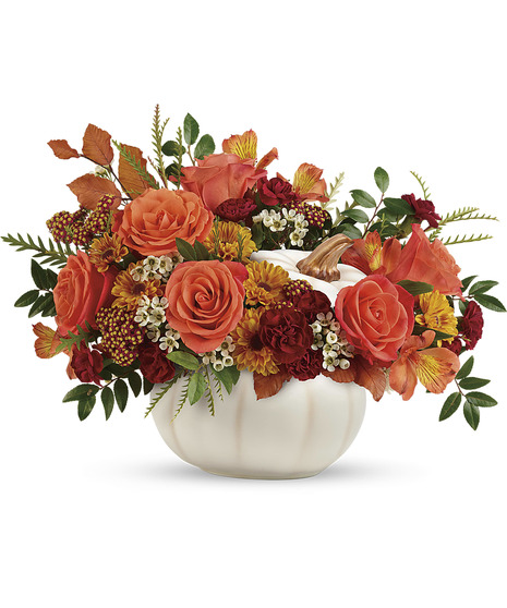 Fall flowers in a white ceramic pumpkin with lid