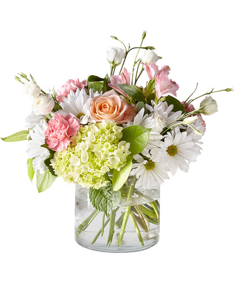 Soft shades of blooms in a glass vase