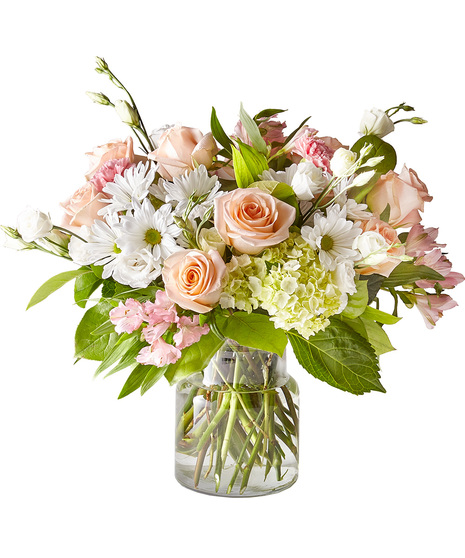 Soft shades of blooms in a glass vase