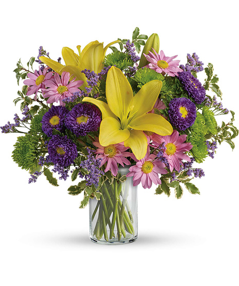 Low priced flowers in a cylinder glass vase