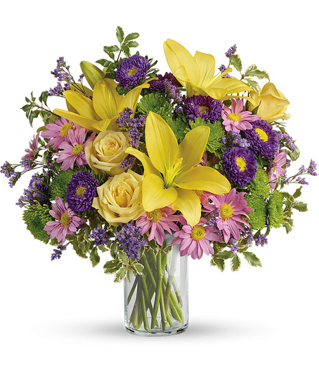 Low priced flowers in a cylinder glass vase
