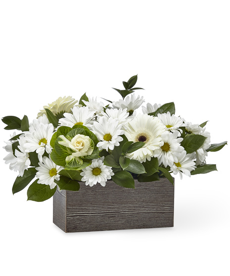White sympathy flowers in a box