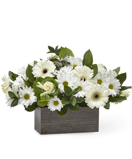 White sympathy flowers in a box