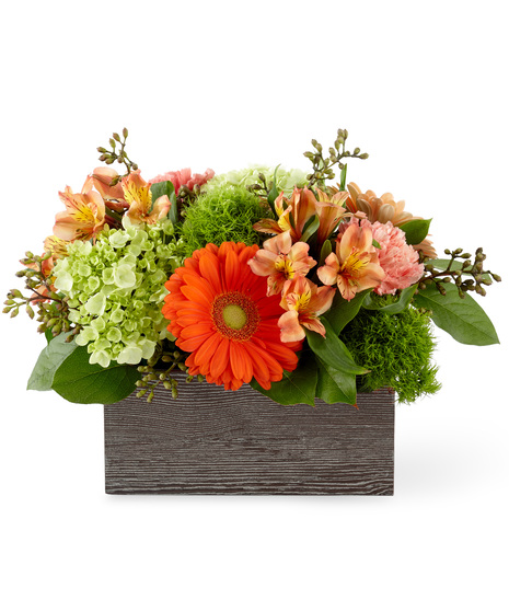 Hydrangeas, gerberas and alstroemeria in a rustic wooden box
