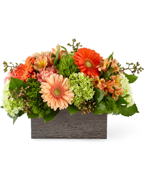 Hydrangeas, gerberas and alstroemeria in a rustic wooden box