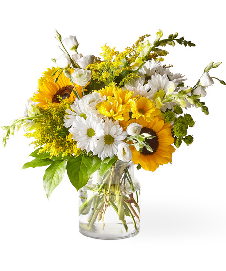 White and yellow flowers in a glass vase