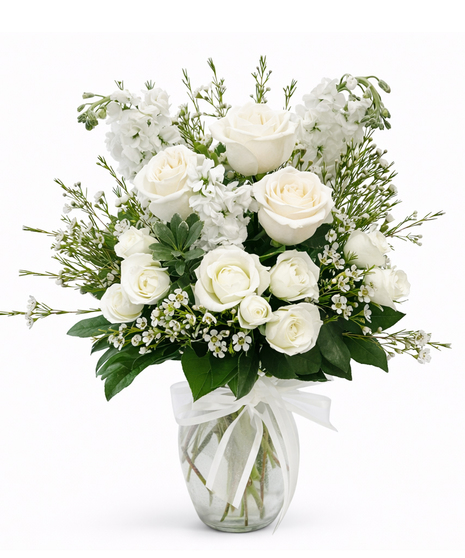 White Flowers designed in a clear glass vase
