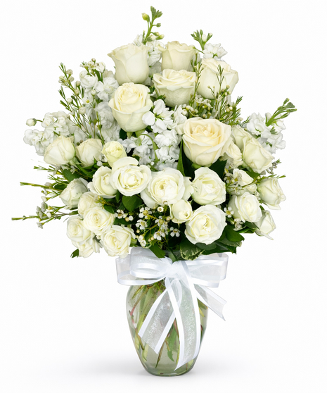 White Flowers designed in a clear glass vase