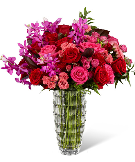 Orchids and roses in a luxury vase