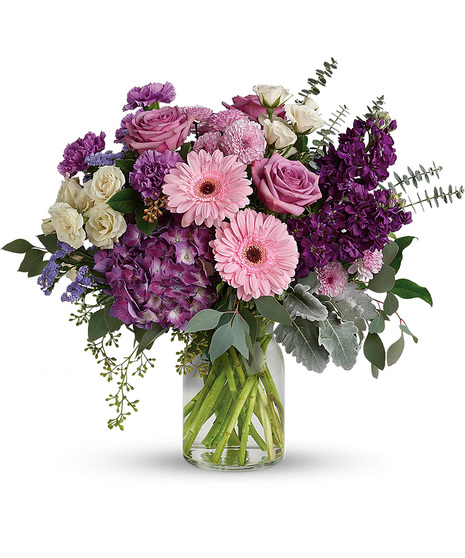 Mauve and Cream Flowers in a Glass Vase