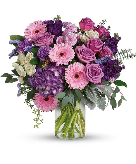 Mauve and Cream Flowers in a Glass Vase