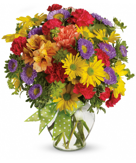 Low priced vibrant flowers in a vase