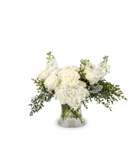 Luxury ivory and white rose bouquet with hydrangea arranged in a clear glass vase