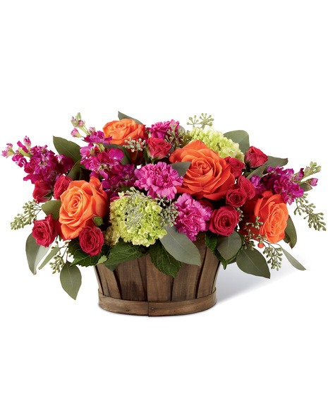 Mixed vibrant flowers in a basket