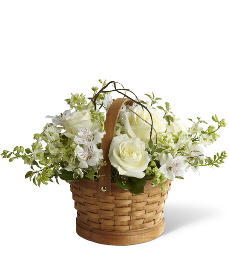 White Sympathy Flowers in a Natural Woven Basket
