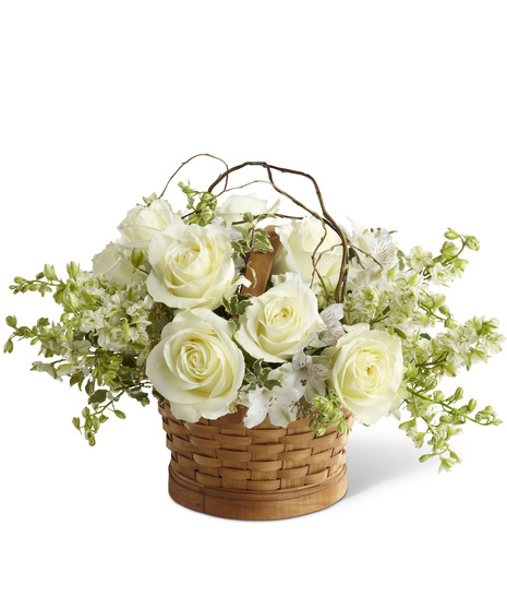 White Sympathy Flowers in a Natural Woven Basket