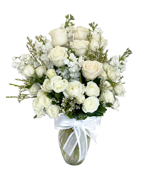 White Flowers designed in a clear glass vase