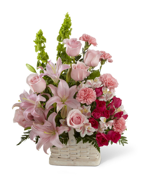 Pink and Red Flowers in a Handled Basket