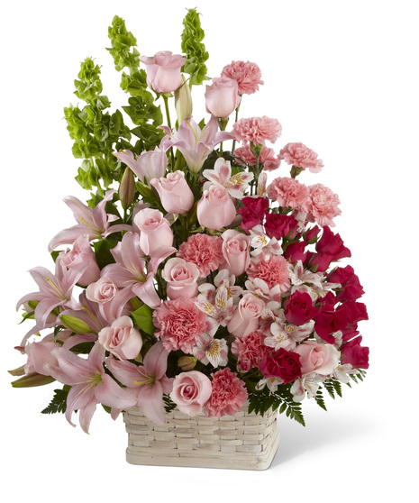 Pink and Red Flowers in a Handled Basket
