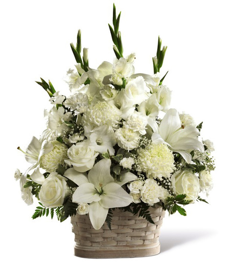 White sympathy flowers arranged in a basket