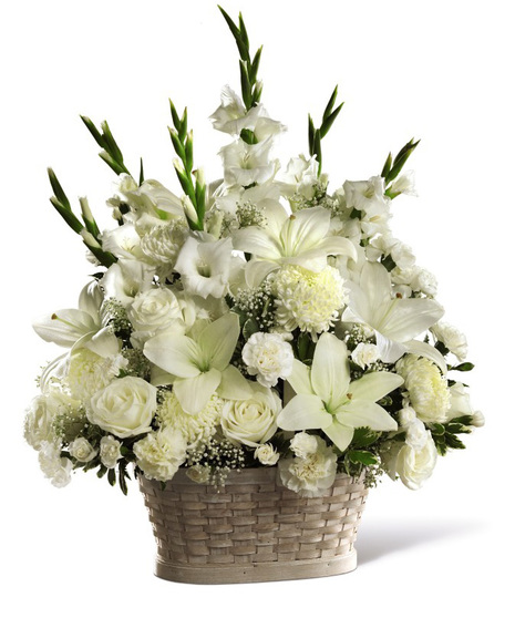 White sympathy flowers arranged in a basket
